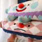 Clown Pet Sleeps In A Cozy Pet Bed